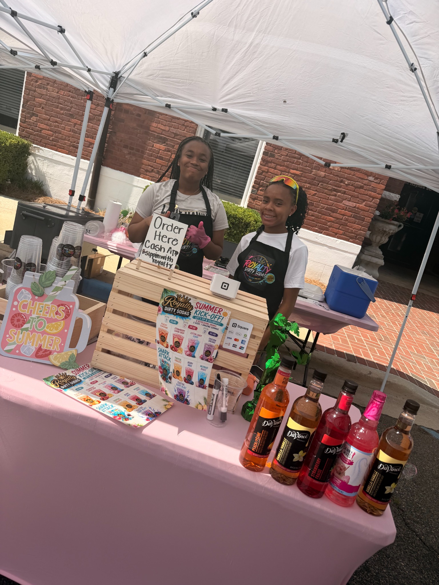 Aubrey and Morgan at the Sippin with Royalty drink stand